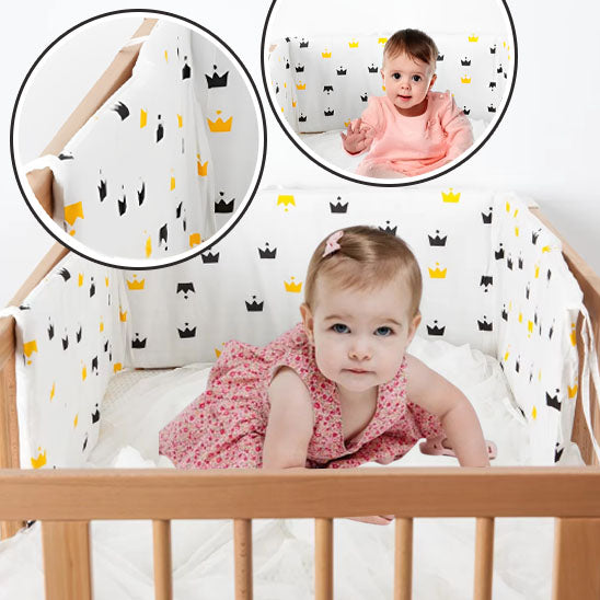 bebe au lit protege par un tour de lit bebe