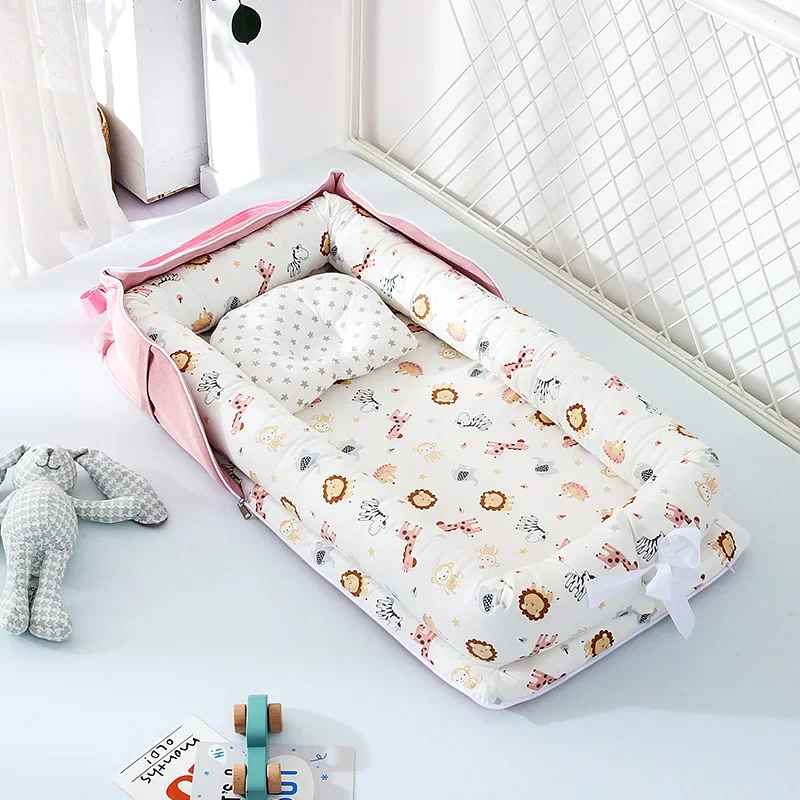 reducteur lit bebe avec doudou