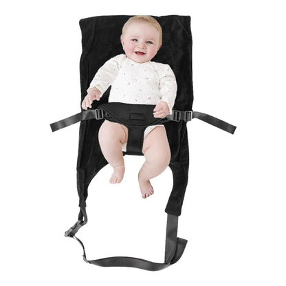bebe attache dans lit bebe de voyage