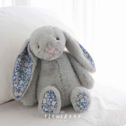 doudou pour bebe gris assis
