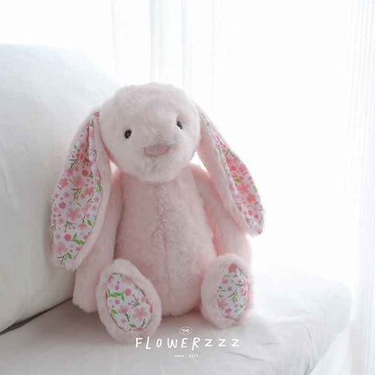 doudou pour bebe rose assis