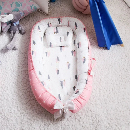 reducteur de lit bebe rose