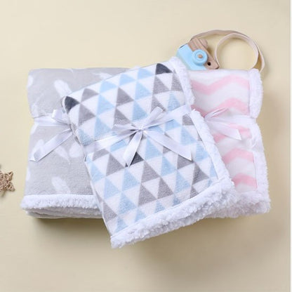 Trois couvertures bébé